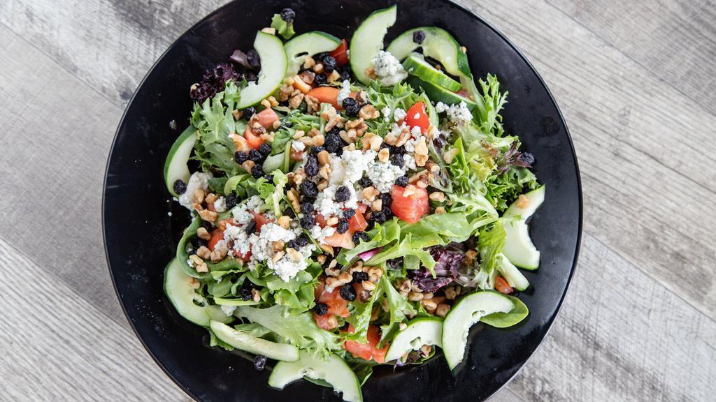 Blue Rock Salad · Lettuce blend, tomato, cucumber, dried blueberries, blue cheese, candy walnuts, poppy seed dressing.