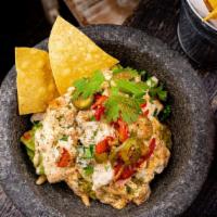 Chesapeake Crab Guacamole · cilantro tartar sauce + pickled chilies + old bay tortilla chips