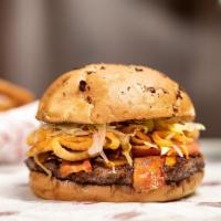Bullseye Bbq Burger · Crispy onions straws, bacon, BBQ sauce, Cheddar, lettuce, tomato, and mayonnaise on a Miami ...