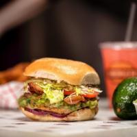 Chicken Club Burger · Flame broiled chicken breast, bacon, Swiss cheese, guacamole, red onions, lettuce, and tomat...