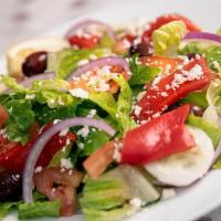 Signature Greek Salad · Romaine lettuce, vine ripened tomatoes, feta cheese, sliced cucumbers, red onions, Kalamata ...
