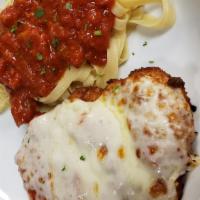 Chicken Parmigiana · Topped with our marinara sauce and mozzarella cheese. served with a side of pasta