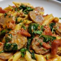 Pasta Corleone · Penne pasta sautéed with Italian sausage, fresh spinach, and garlic in our spicy, creamy vod...