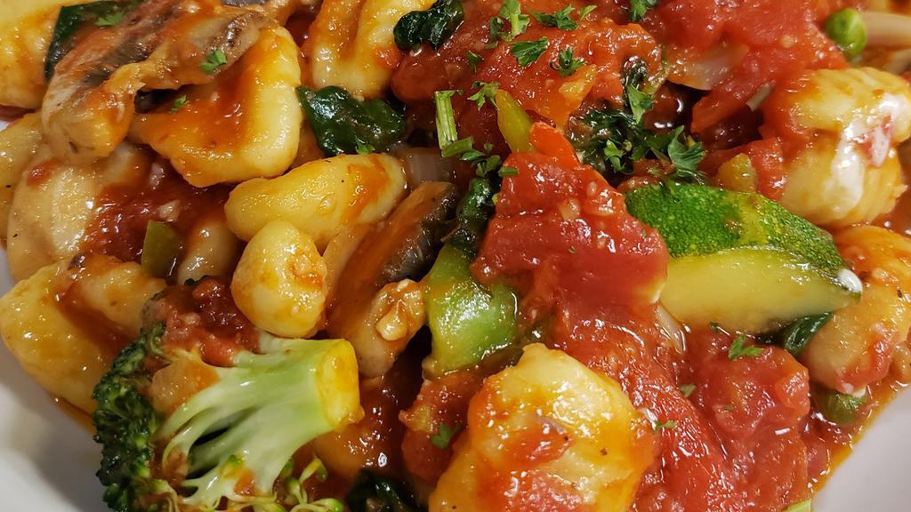 Veggie Gnocchi · Potato dumpling pasta sautéed with fresh garden vegetables and our marinara sauce.