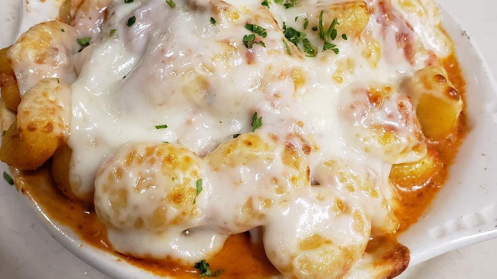 Penny'S Gnocchi · Potato gnocchi simmered in our spicy vodka sauce, topped with mozzarella and baked en casserole.