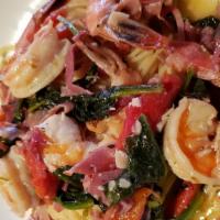 Shrimp Salerno · Jumbo shrimp, prosciutto ham, spinach, and roasted red bell peppers in a garlic butter white...