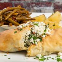 Spanakopita · Spinach and feta cheese wrapped in phyllo. Served with Greek potatoes and fasolakia.