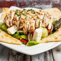 Greek Salad · Crispy romaine lettuce, tomato, cucumber, onion, feta cheese, pepperoncini pepper, domadakia...