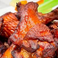 Naked Wings · Gluten free. One dozen brined and fried chicken wings ( not breaded ) tossed in choice of sm...