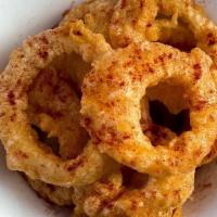 Pub Onion Rings · Fried onion rings, Smokeheads Texas Mop BBQ sauce.