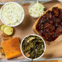 Arkansas Brisket · Double Smoked, rough cut, sweet & smoky sauce