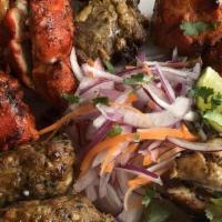 Tandoori Mixed Grill Platter · Assorted grilled tandoori chicken, chicken tikka, reshmi kebab, chicken sheekh kabab, and a ...
