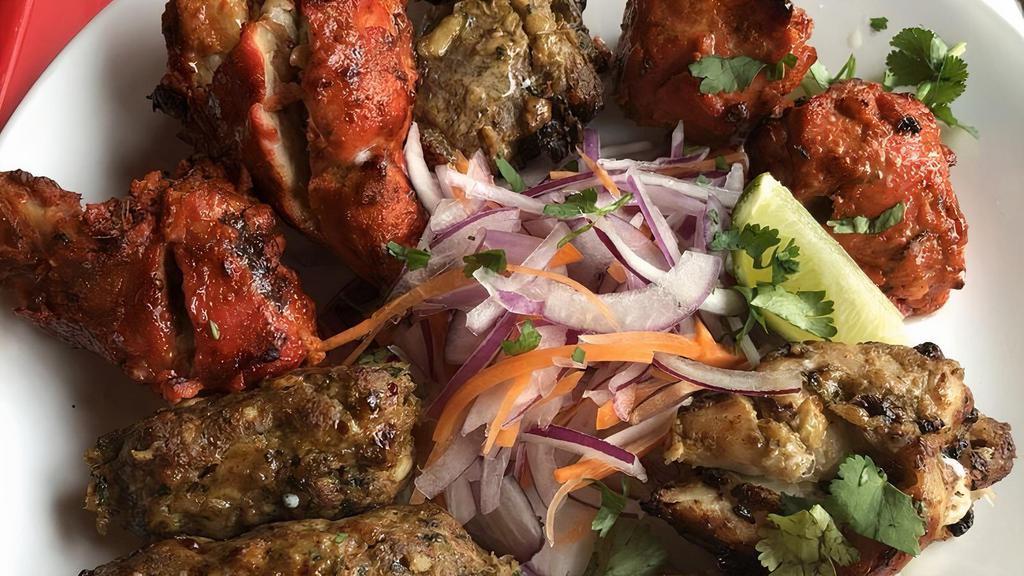 Tandoori Mixed Grill Platter · Assorted grilled tandoori chicken, chicken tikka, reshmi kebab, chicken sheekh kabab, and a choice of lamb chop or two pieces of shrimp.