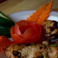 Chicken Reshmi Kebab (Malai) · Boneless chicken marinated in a silky cream sauce and cooked in our clay oven.