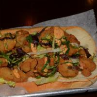 Fried Oyster Sub · Fried oyster, shredded lettuce, red cabbage and remoulade sauce. Add fries for an additional...