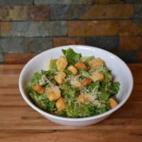 Classic Caesar Salad · Freshly cut romaine hearts, lightly tossed in Caesar dressing and shredded Parmesan, topped ...
