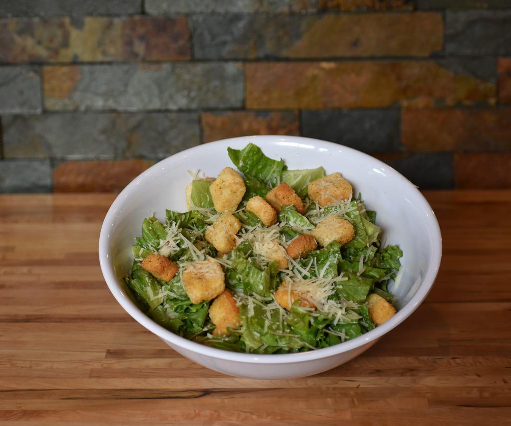 Classic Caesar Salad · Freshly cut romaine hearts, lightly tossed in Caesar dressing and shredded Parmesan, topped with croutons. Add chicken, avocado, or grilled shrimps for an additional charge.