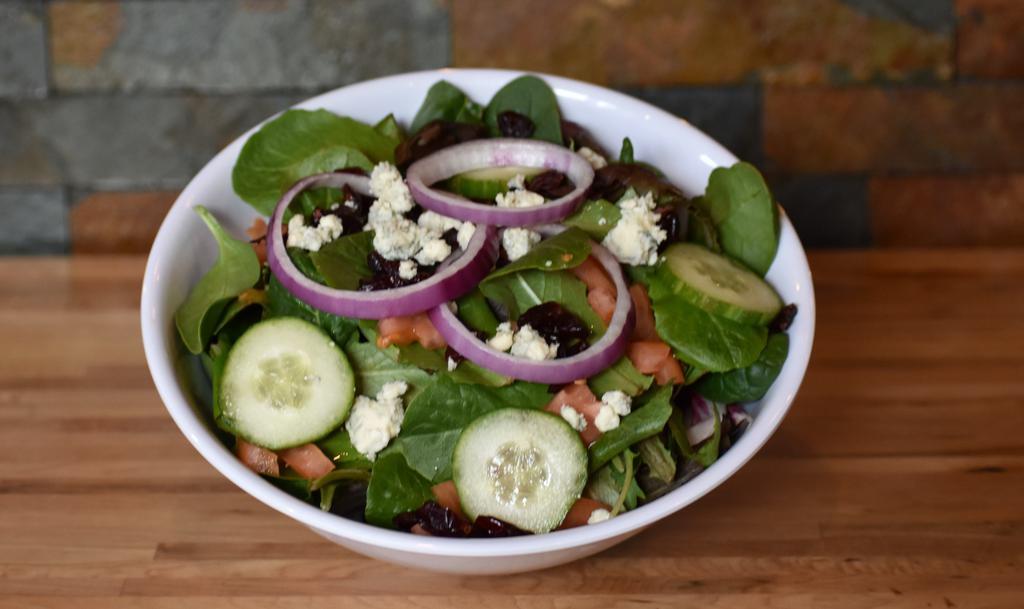 District House Salad · Fresh mesclun mix with sliced tomatoes, sliced cucumbers, sweet red onions, shredded carrots and dried cranberries. Add chicken, avocado, or grilled shrimps for an additional charge.