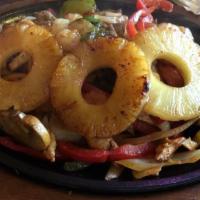 Fajita Hawaiiana · Steak, chicken, shrimp, mushrooms, and pineapple with red and yellow peppers and tomatoes.