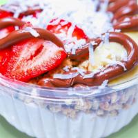Coco Sweet Coconut Bowl · Our flavorful coconut base topped with granola, banana, strawberry, coconut flakes, and Nute...