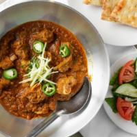 Chicken Karahi (2 Person) · Two naans. Chicken meat with bone simmered in onions, tomatoes, and fresh ginger garlic and ...