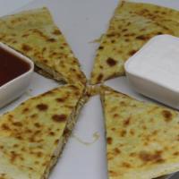 Quesadillas · Filled with cheese & grilled onions, served with sides of salsa & sour cream