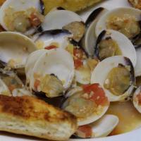 Clams In White Wine Garlic Sauce · 1 LB. of Clams cooked in white wine garlic sauce, side salad & garlic bread.