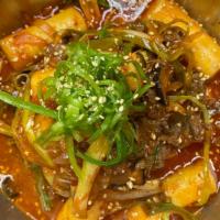 Spicy Bulgogi Stir Fry · Chewy rice cakes, gochujang, shiitakes, onions.