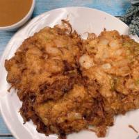 Shrimp Egg Foo Young · With white rice.