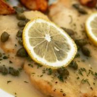 Chicken Picatta (Gf) · Gluten-free. Chicken breast creamy white wine and lemon sauce, topped with capers. Served wi...