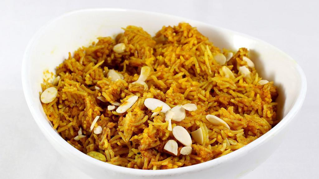 Vegetable Biryani · Naturally fragrant basmati rice cooked with fresh garden vegetables sprinkled with nuts.