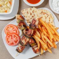 Chicken Kabob · One skewer of cubed marinated chicken breast with onions and peppers served with rice or pot...