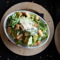 Caesar Salad · Chopped romaine lettuce with croutons, shredded parmesan cheese and Caesar dressing served o...