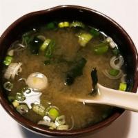 Miso Soup (8Oz) · Soybean Broth with Green Onion, Seaweed, and Tofu inside.