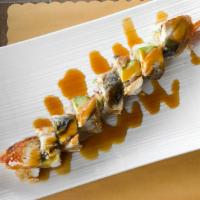 Dragon Roll · Rolled with shrimp tempura, avocado and crab meat wrapped with  eel and eel sauce on top.