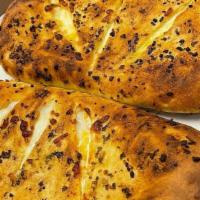 Cheese Bread · Garlic bread topped with mozzarella.