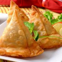 Vegetable Samosa Large · Pastry with a filling of spiced potatoes and green peas deep-fried in canola oil to a golden...