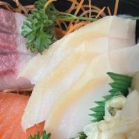 Sashimi Deluxe · 20 pieces of beautifully arranged chef's choice of raw fish served with rice.