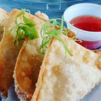 Crab Rangoon · creamy & crispy fried dumplings filled with imitation crab meat & served with sweet chili sa...