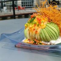 Dragon Egg · Whole avocado stuffed with crab mix, spicy tuna, fresh cut lemon & scallions. Topped with sp...