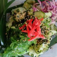 Cucumber Salad · Marinated thinly sliced cucumbers, seaweed salad & imitation crab meat dressed in a citrus s...