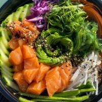 Poke Bowl · Rice & mixed greens topped with cucumbers, seaweed salad, purple cabbage, carrots, daikon, g...
