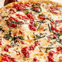 Margherita Pizza · Fresh mozzarella, plum tomato sauce and basil.