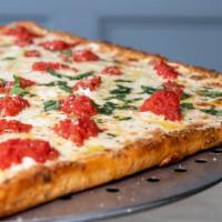 Grandma Pizza · Thin crust pan pizza, fresh mozzarella, plum tomato sauce and fresh basil.