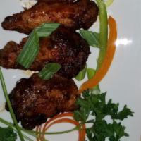 Wings · Serve with your choice of yellow rice or red beans and rice and steamed vegetables or our si...