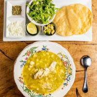 Pozole Verde · Traditional tomatillo soup with pulled chicken and hominy. Served with a side of shredded le...