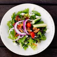 House Salad · Mix greens, feta cheese, chopped tomatoes, cucumbers, red onions, and walnuts with balsamic ...
