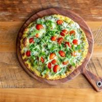 Pesto Margherita Pizza (Veg) · Cherry tomatoes, fresh mozzarella, arugula and fresh. homemade basil pesto
