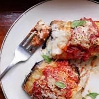 Eggplant Rollatini · Slices of eggplant, lightly breaded and covered with ricotta and other cheeses and seasonings.