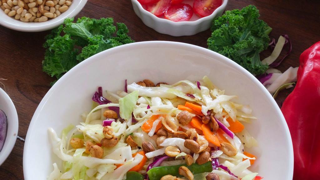 Crunchy Asian Salad (Vegan) · Napa cabbage, cabbage red and white snow peas. Scallions, carrots, baby kale,cilantro, bell peppers, mung beans and roasted sriracha peanuts.